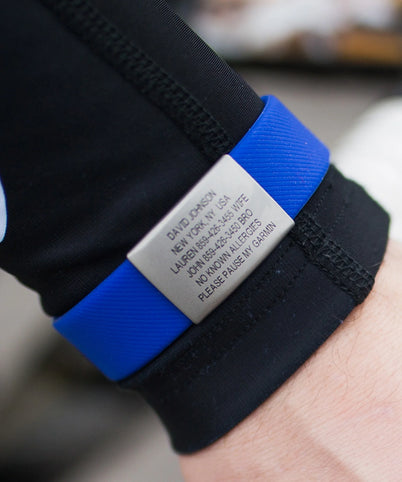 Close up of wrist with blue and slate Sport Pin Tuck ROADiD.