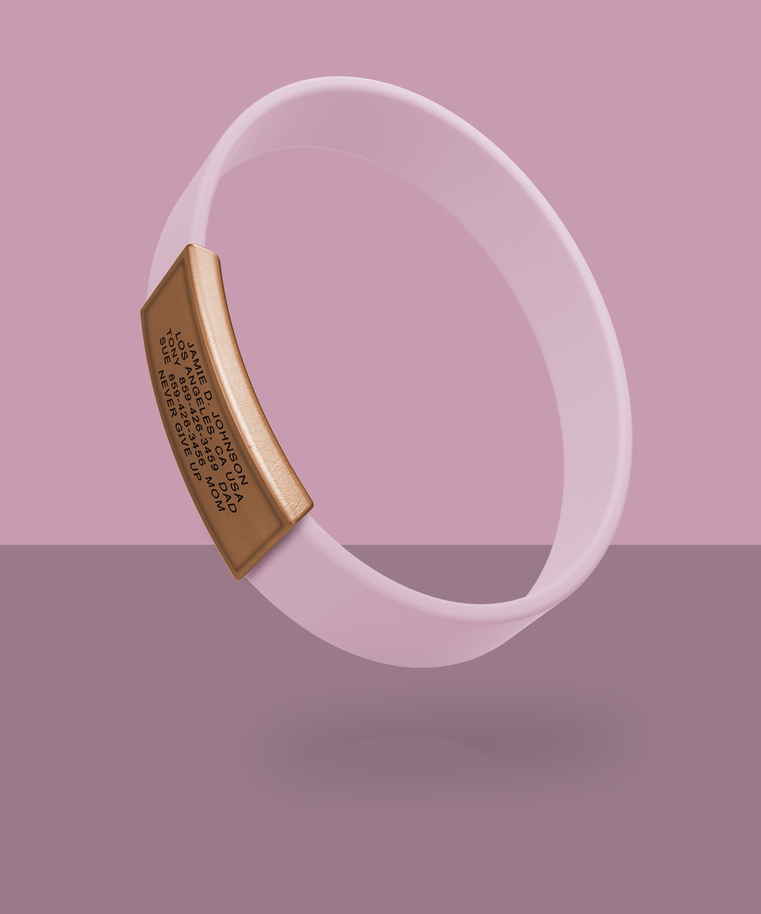 Pink ROADiD with a rose gold plate on a pink background