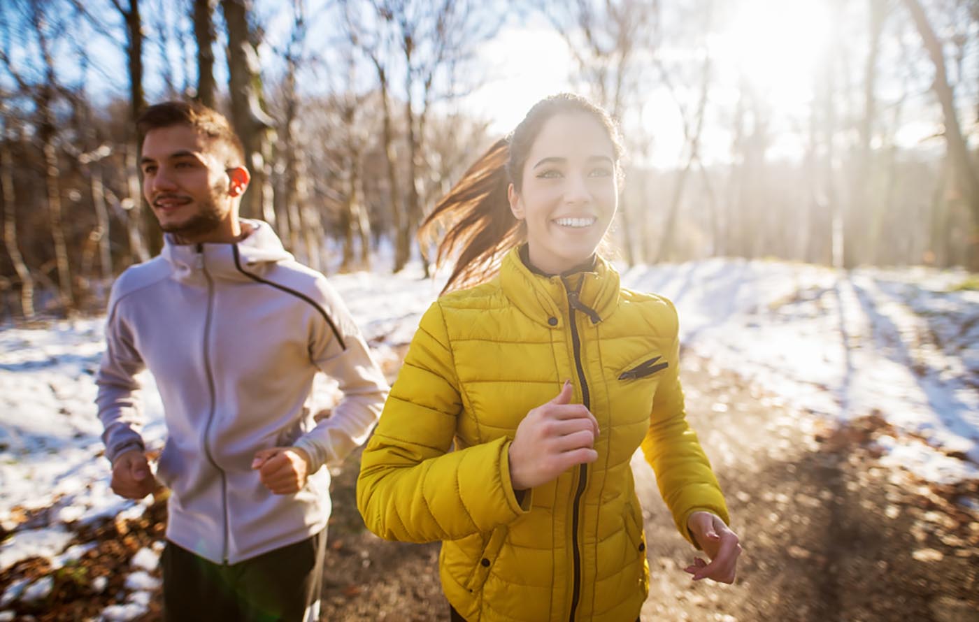 couple running in snow