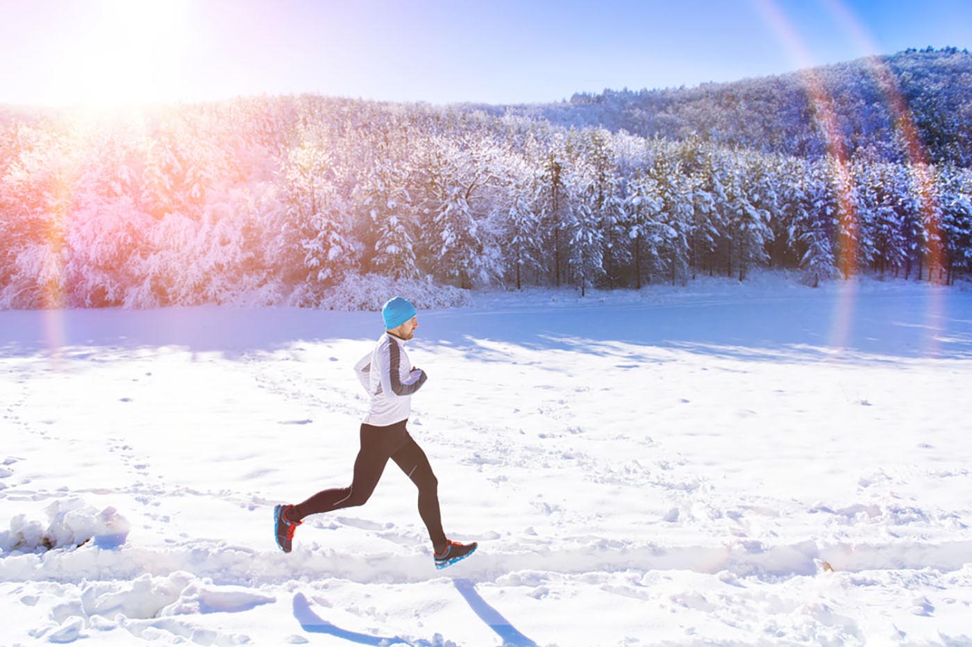 man running snow trail