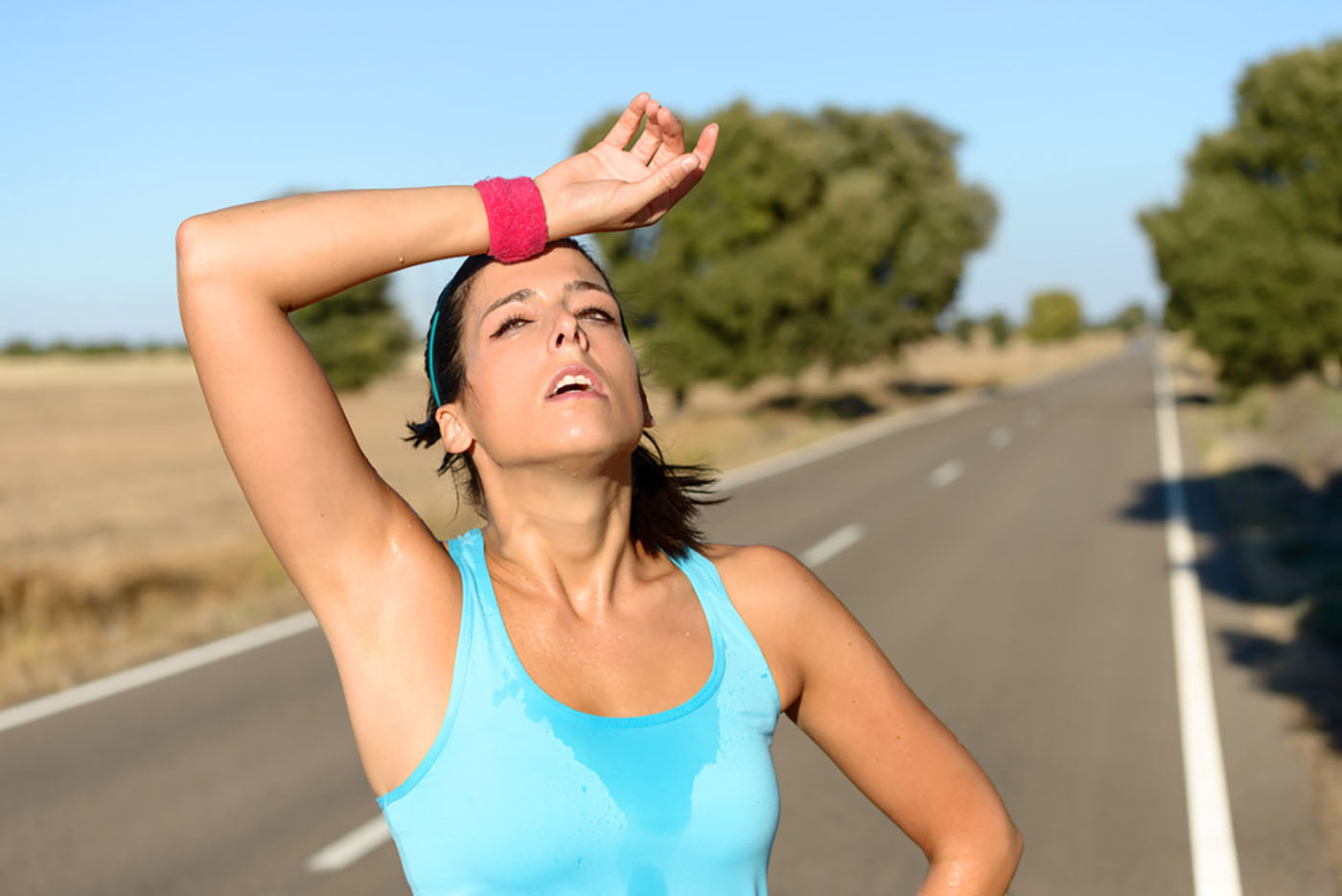runner taking break on road