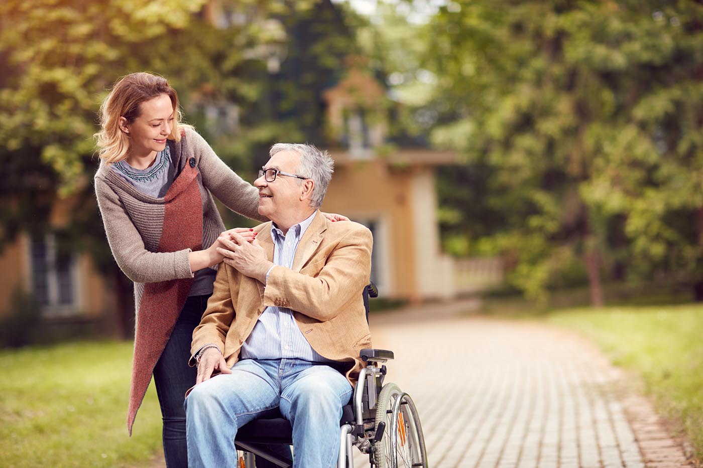 elderly man outdoors with family