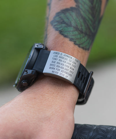 ROADiD Garmin ID on tattooed cyclist's wrist.