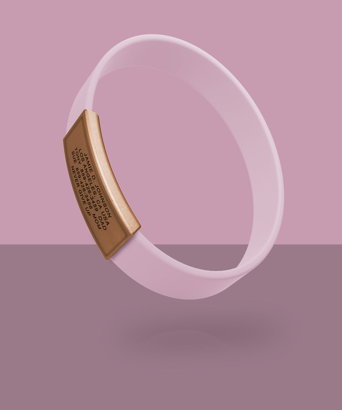 Pink ROADiD with a rose gold plate on a pink background