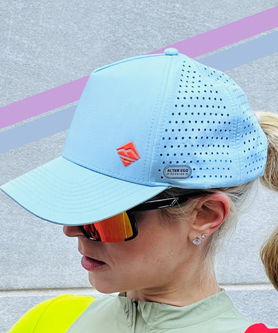 Close up of ROADiD Performance hat on woman wearing cool sunglasses.